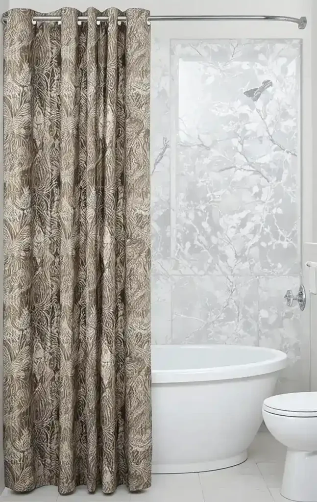 Waterproof liner behind bathroom curtain protecting fabric and floor.